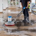 Cleaning floor with machine